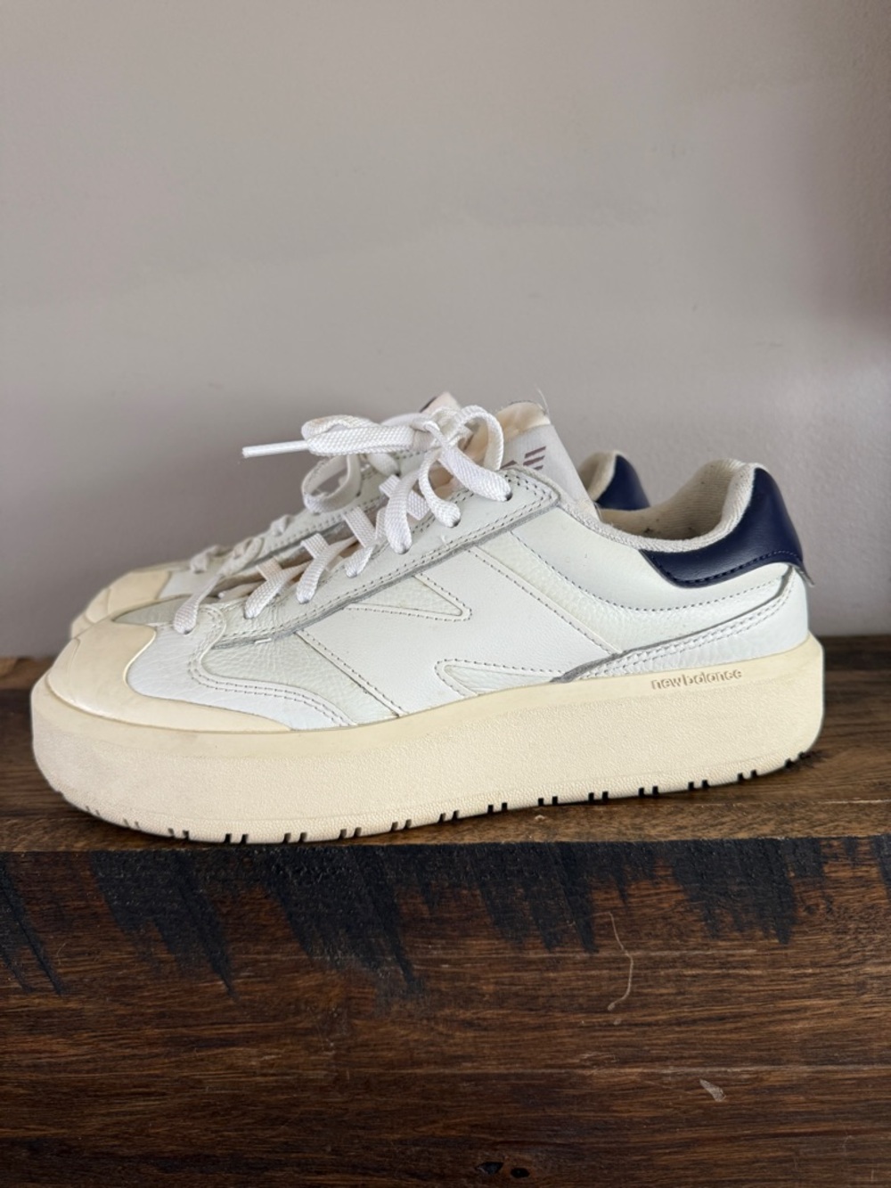 New Balance White Sneakers with Navy Accents and Yellow Lining
